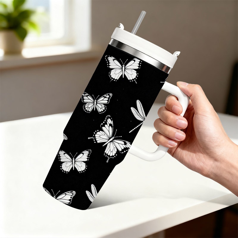 Sublimation Mug White - แก้วเก็บความเย็นสแตนเลสสองชั้น ขนาด 40 ออนซ์ พร้อมหูจับและหลอดดูด, พื้นหลังสีดำพิมพ์ลายผีเสื้อและแมลงปอบินด้วยเทคนิคซับลิเมชัน,